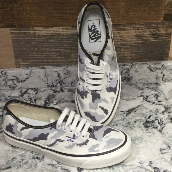 white and grey camo vans